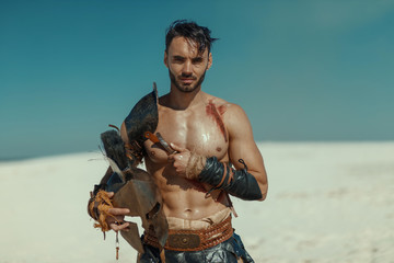 Male athlete in the armor of an ancient warrior