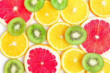 Fototapeta na wymiar close up of citrus slice, kiwi, oranges and grapefruits isolated on white background. Fruits backdrop