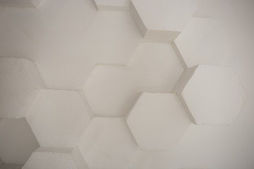 wall background. background texture. wall with textured hexagons. the diamonds on the wall. white wall