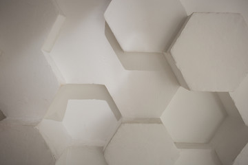 wall background. background texture. wall with textured hexagons. the diamonds on the wall. white wall