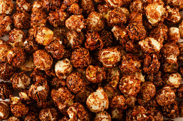 Scattered chocolate popcorn texture background