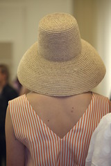 Fashionable summer hat on the female head.
