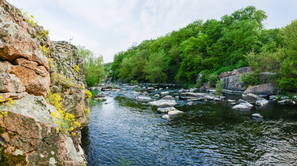 Panoramic view of the river section with rocky shore