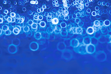 background bokeh blue rings / texture blurred background defocusing blue abstract