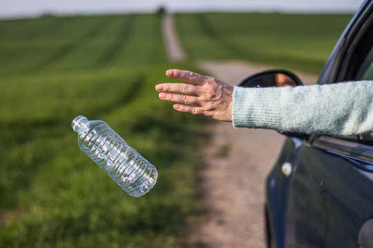 Throwing Away Plastic Bottle From Car