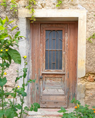 Fototapeta na wymiar old house entrance weathered wood door, Athens Greece