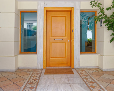 contemporary apartment building entrance wooden door, Athens Greece