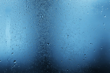 wet glass background condensate / abstract rain, drops texture on transparent glass