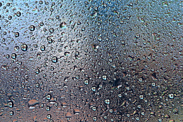 gray wet background / raindrops to overlay on the window, weather, background drops of water rain on the glass transparent