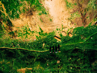 Hikers people hiking - healthy active lifestyle. Hiker people hiking in beautiful mountain nature landscape. Woman and man hikers walking during trekking hike.steadycam shot