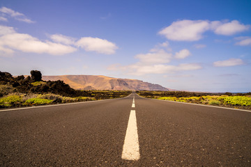 Spain, Lanzarote, Bolt upright highway through beautiful scenery