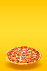 Creative layout of hot delicious pizza in flying on summer orange background. Pizza pepperoni design mockup flyer or poster for promotions and discounts with copy space. Fast Food concept