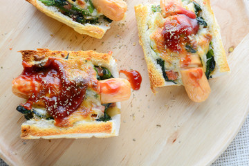Baked Spinach with Cheese, sausage on Baguette, French bread.