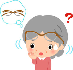 眼鏡をつけたまま眼鏡を探すシニア女性