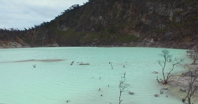 Drone aerial view across the Sulphur Lake at White crater or Kawah Putih in Ciwidey West Java, Near Bandung city, Indonesia