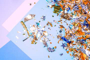 Colorful celebration background with confetti,stars, fireworks and decoration on blue background. Flat lay. 
