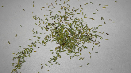 fragrant dry rosemary spice scattered on the table while cooking