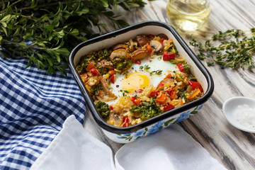 Baked vegetables with egg. Healthy food. Homemade.