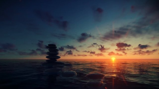 Pebbles on water against beautiful timelapse sunrise, zoom in