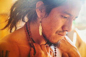 Closeup of native american man with beautiful jewelry