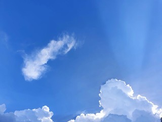 Beautiful nature of blue sky and clouds with the sun shining in the morning, sky background, cloudscape concept, Looking up