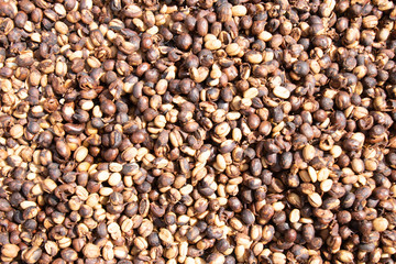 Coffee beans background.Brown roasted coffee beans pattern in coffee shop prepared for making cappuccino or latte hot drink.