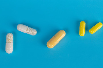 White and yellow medicinal tablets and capsules