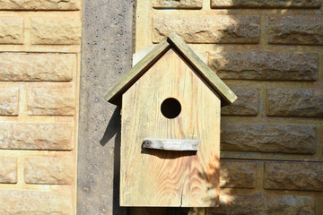 Closeup of a weathered birdhouse.