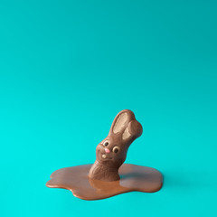 Easter chocolate bunny rabbit melting. Creative Easter holiday concept background. Minimal style. - 263660710
