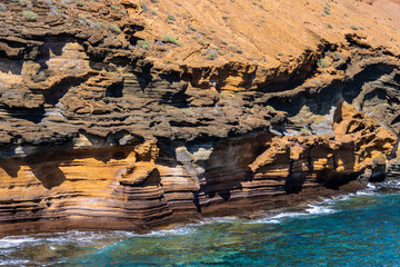 Spectacular orange cliffs and the ocean - Image