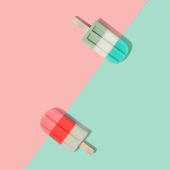 Ice cream popsicles in pastel pink and blue colors on paper duotone background. Minimal summer concept. Flat lay.