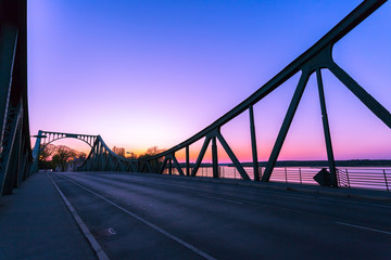 Fototapeta na wymiar Glienicker Bridge in Berlin, colorful evening scenery