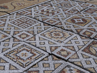 Elements of an ancient ceramic mosaic on the stone