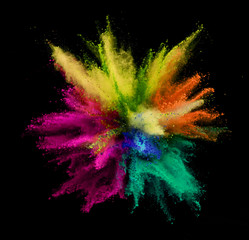 Explosion of colored powder on black background