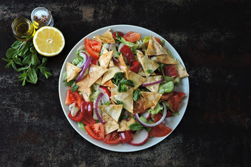 Middle Eastern salad with pita bread and vegetables. Fattush Salad.