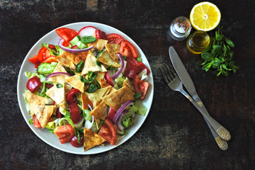 Middle Eastern salad with pita bread and vegetables. Fattush Salad.