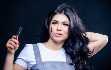 Obraz premium Girl makeup face hold tweezer for eyelash extension. Makeup false lashes volume. Lash applicator. Professional eyelash extension tweezer. Makeup artist. Cosmetic tweezer. Beauty shop concept