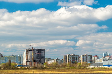 Fototapeta premium House under construction in the city against the blue sky.