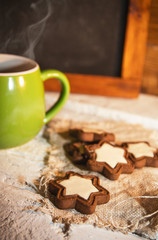 Morning coffee with some star-shaped chocolate cookies