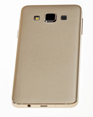 Golden smartphone on white background.