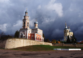 Church in the autumn landscape of the city. The Church dome surrounded by beautiful autumn trees. ...