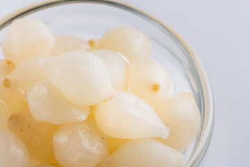 pickled vegetables on a white acrylic background
