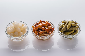 pickled vegetables on a white acrylic background