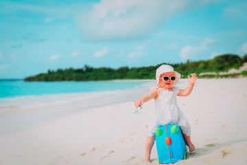 cute little girl travel on summer beach