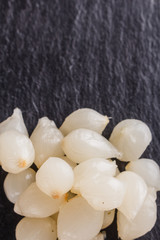 pickled vegetables on a dark stone background
