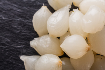 pickled vegetables on a dark stone background