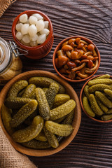 pickled vegetables on a wooden rustic background
