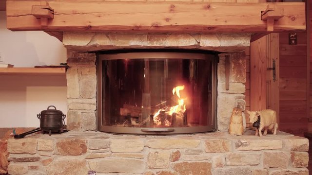 Romantic Couple Sit By Cozy Fireplace in a Pretty Cabin.