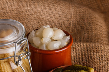 pickled vegetables on a wooden rustic background