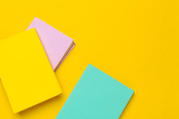 Books on a yellow background